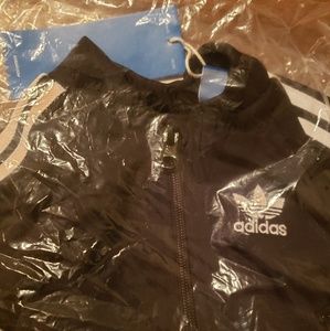 Adidas track suit. new with tags. Size 9M